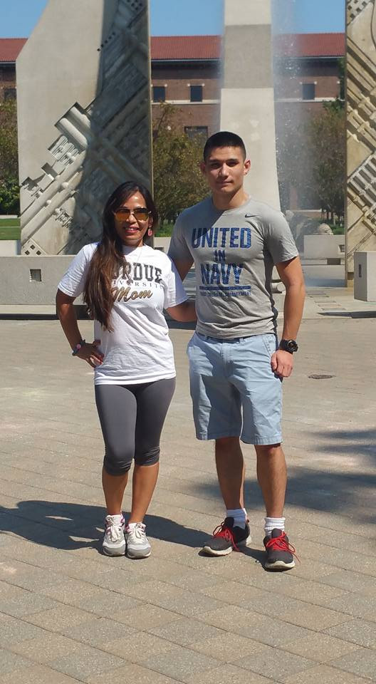 Derek standing with his mom, Lianna, in front of the Purdue Engineering fountain