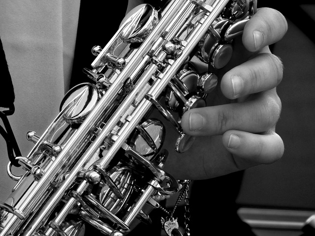 Fingers on the keys of a saxophone