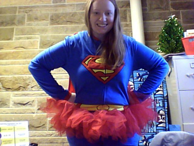 Jessica dressed and posing as superman with a red tutu