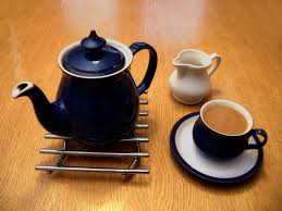 teapot with cup and milk